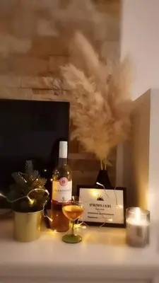 a bottle of alcohol and a glass on a table at Apartman Laura in Kopaonik