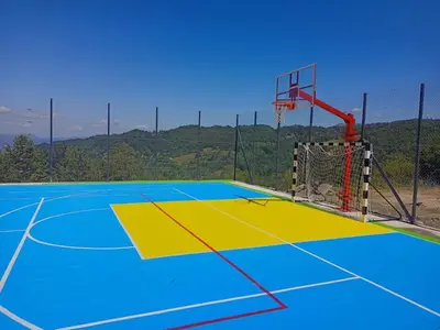 a basketball court with a hoop on it at Apartman Laura in Kopaonik