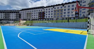 a basketball court in front of a building at Apartman Laura in Kopaonik