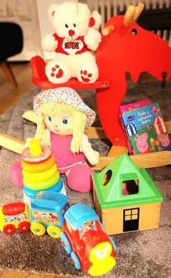 a group of toys sitting on the floor next to a table at Tizza apartment - Modern flat above the city center in Niš