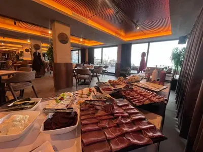 a buffet line with different types of meats and food at Milmari N66 in Kopaonik
