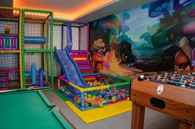 a childrens play room with a pool table at Milmari N66 in Kopaonik