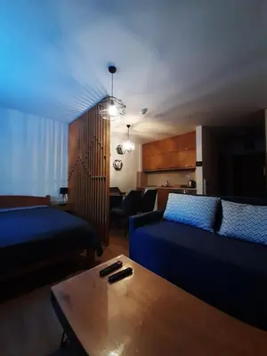 a living room with a couch and a coffee table at Twin mountain in Kopaonik