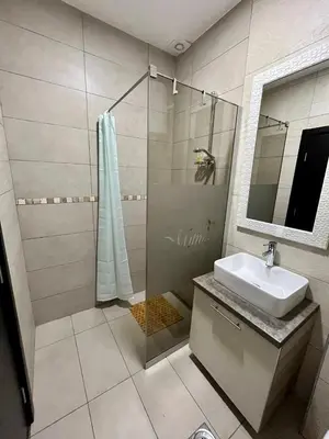 a bathroom with a sink and a shower at Apartman K3 Milmari Kopaonik in Kopaonik