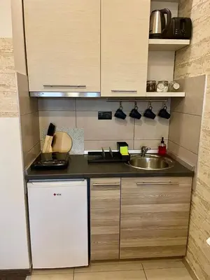 a kitchen with a sink and a counter top at Apartman K3 Milmari Kopaonik in Kopaonik