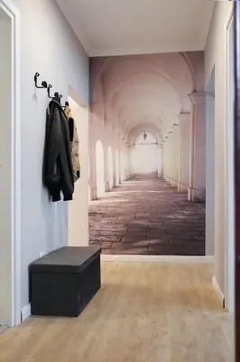 an empty hallway with a painting on the wall at Heart of Niš in Niš