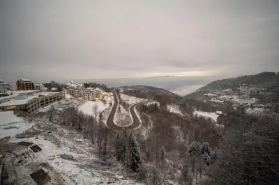 a road in the snow on a mountain at PLEASURE LUX GOLD in Kopaonik