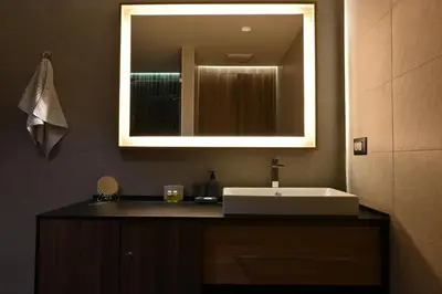 a bathroom with a sink and a mirror at KOPAONIK WOODSIDE 58,70 m2 FREE Parking in Kopaonik