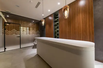 a wine tasting room with a large white tub at KOPAONIK WOODSIDE 58,70 m2 FREE Parking in Kopaonik