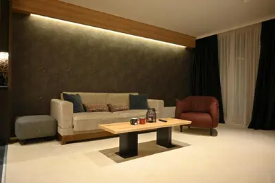 a living room with a couch and a coffee table at KOPAONIK WOODSIDE 58,70 m2 FREE Parking in Kopaonik