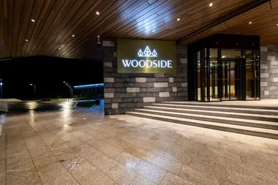 a woodside sign on the side of a building at WOODSIDE Apartment M Kopaonik FREE Parking in Kopaonik