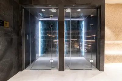 two glass elevator doors in a building at WOODSIDE Apartment M Kopaonik FREE Parking in Kopaonik