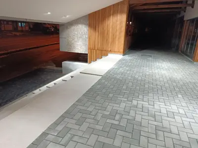 a hallway with a tile floor in a building at Kopaonik Apart Bela Reka Brzece in Brzeće