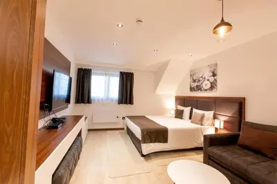 a hotel room with a bed and a couch at Kopaonik Zoned 2 in Kopaonik