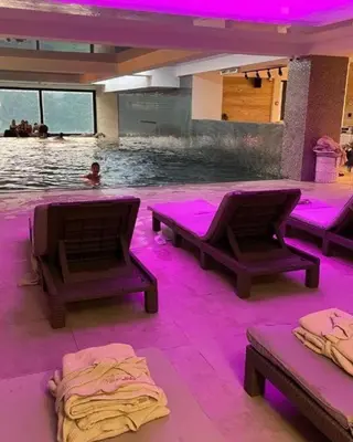 a swimming pool with purple lights in a room at Kopaonik Zoned 2 in Kopaonik