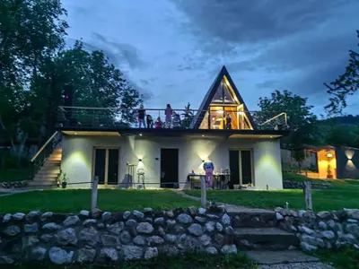 a house with people standing on the roof at Brvnara Riva in Niš