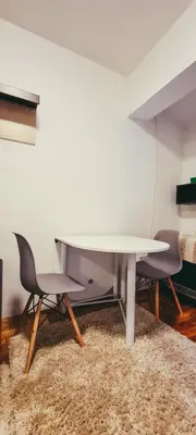 a white table and two chairs in a room at The spots - 300m from the Gondola in Brzeće