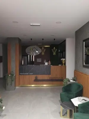 a restaurant with a bar in the middle of a lobby at President Kop A-406 - Apartman Wiseman in Kopaonik