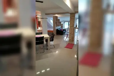 a view of a room with a living room and a kitchen at LUX Apartmani Jagodina in Jagodina