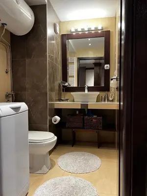 a bathroom with a toilet and a sink and a mirror at Winter magic centar in Kopaonik