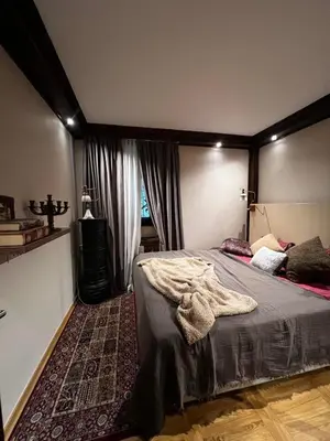 a bedroom with a bed in a room with a window at Winter magic centar in Kopaonik
