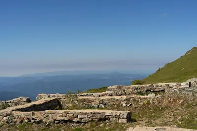 a stone wall on the side of a mountain at Woodside Kopaonik 417-418 in Kopaonik