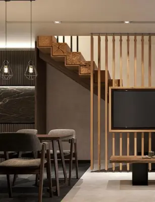 a living room with a tv and a staircase at Woodside Duplex Apartment Ski in Ski out with garage in Kopaonik