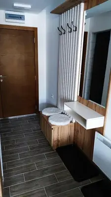 a bathroom with a sink and a mirror at President Kop apartmani Vista & Sol in Kopaonik
