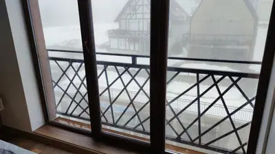 a view from a window of a balcony at President Kop apartmani Vista & Sol in Kopaonik