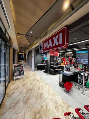 a mayx store with a large sign on the wall at Apartments Myna in Kraljevi Cardaci in Kopaonik