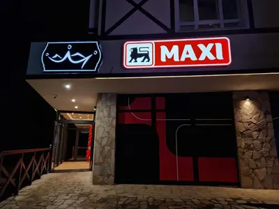 a maxx sign on the side of a building at Euphoria Milmari Resort Kopaonik in Kopaonik