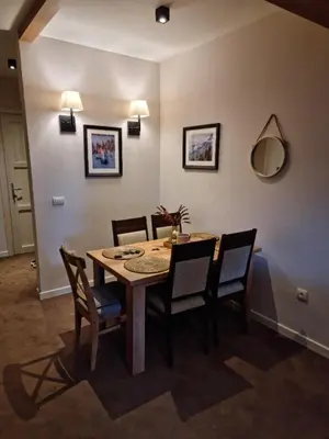 a dining room with a table and chairs at BB Apartment 301, Župa Apartments in Kopaonik
