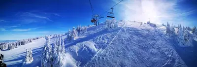 a ski lift going up a snow covered mountain at BB Apartment 301, Župa Apartments in Kopaonik
