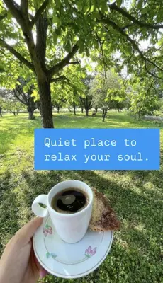 a person holding a cup of coffee and a piece of toast at Green Village Life in Katun