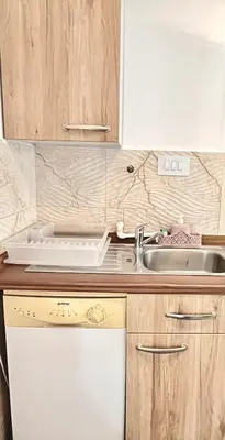 a kitchen with a sink and a counter top at Green Village Life in Katun