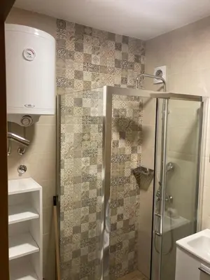 a bathroom with a shower and a sink at BELE STAZE 18 - BRZEĆE KOPAONIK in Brzeće