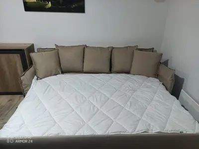 a bed in a room with a white mattress at BELE STAZE 18 - BRZEĆE KOPAONIK in Brzeće