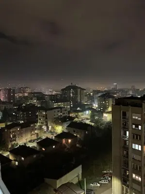 a view of a city at night with lights at City view - next to Delta Planet in Niš