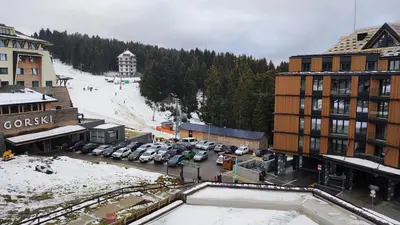 an aerial view of a ski resort with a parking lot at KULA ANDJELA KONACI - Kopaonik Ski Centar in Kopaonik