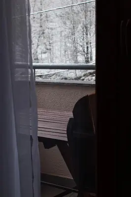 a window with a view of a snow covered yard at Vila MMBS in Brzeće