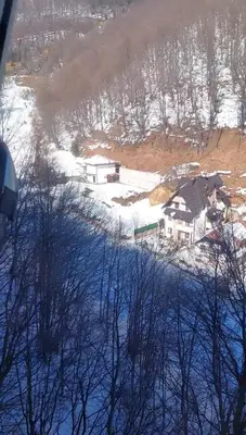 a house in a field with snow on the ground at Vila MMBS in Brzeće