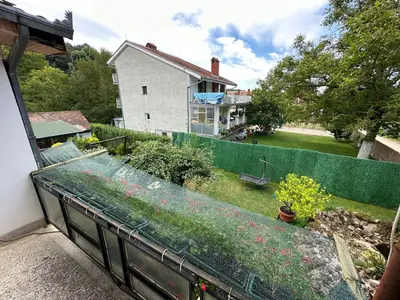 a view of a garden from a balcony of a house at Etno kuća Trifunović in Pretrešnja
