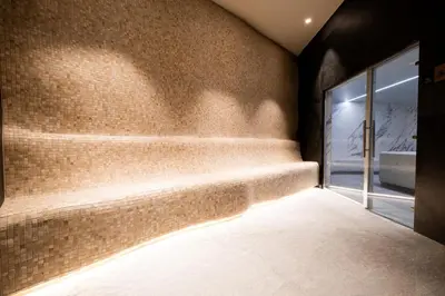 a staircase in a room with a brick wall at Woodside Residences & SPA in Kopaonik