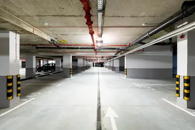 an empty parking lot in a parking garage at Woodside Residences & SPA in Kopaonik