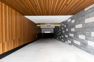 an empty corridor with a wooden ceiling and a tunnel at Woodside Residences & SPA in Kopaonik