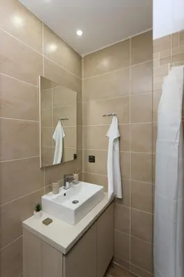 a bathroom with a sink and a mirror at Mountain Side Kopaonik in Kopaonik