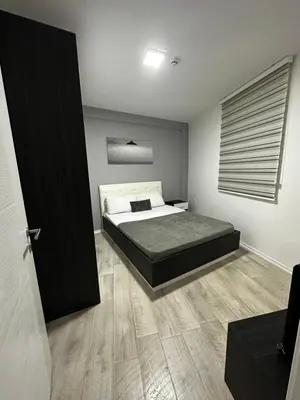 a bedroom with a bed in a room at White Apartman Kopaonik in Kopaonik