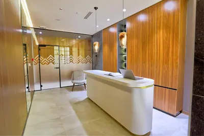 a lobby with a desk with a laptop on it at Woodside Apartman Kopaonik 315 in Kopaonik