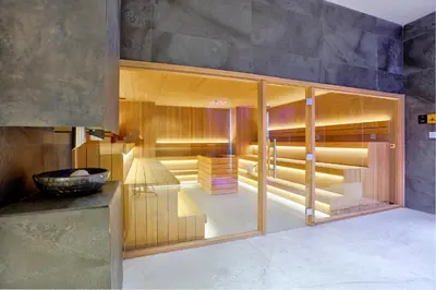 a room with glass doors and a counter at Woodside Apartman Kopaonik 315 in Kopaonik