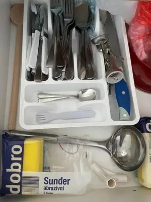 a drawer full of kitchen utensils in a drawerlictsangering at Vuk apartment - Milmari Resort & Spa in Kopaonik